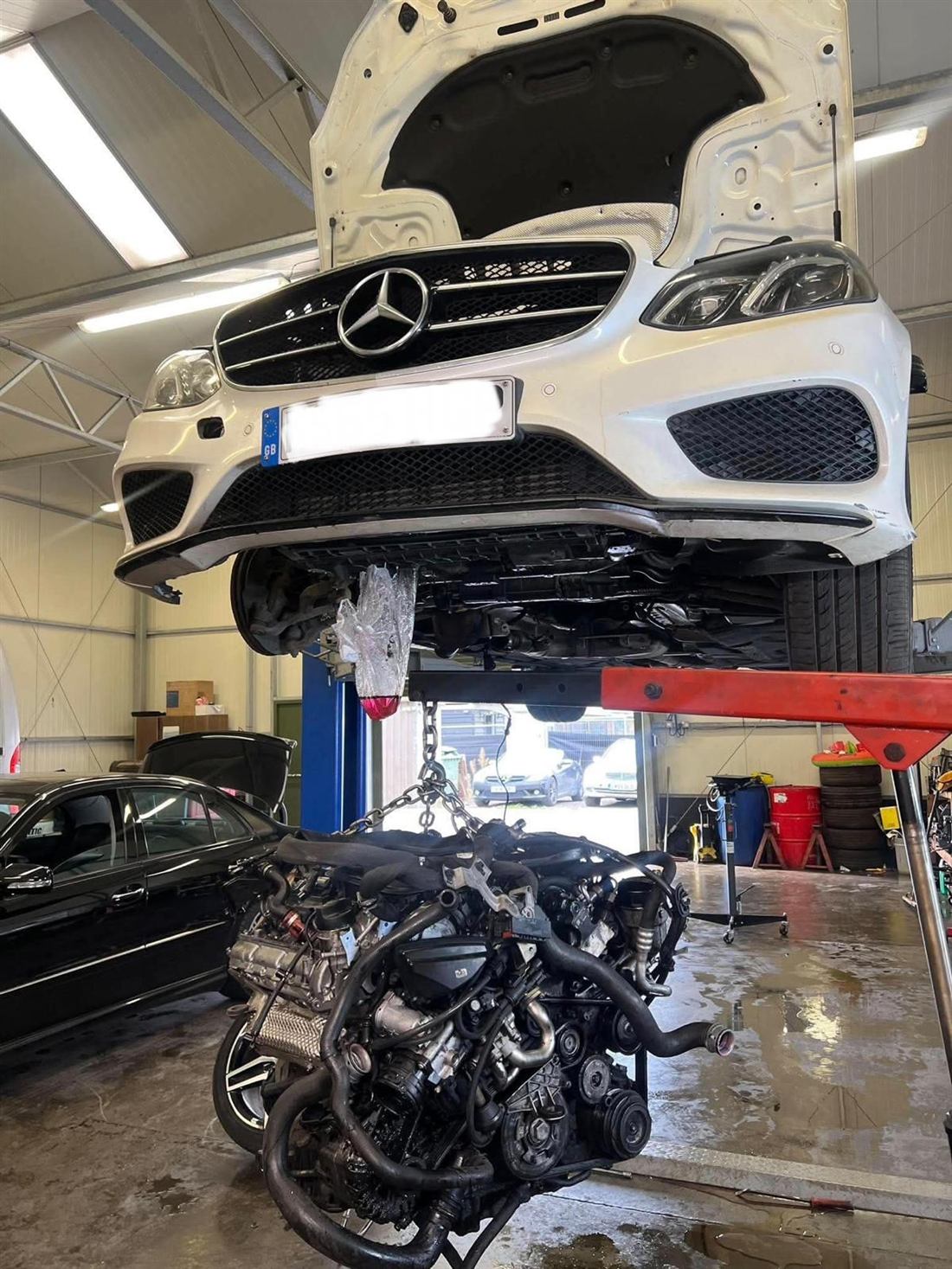Mercedes E-Class on the lift with engine removed