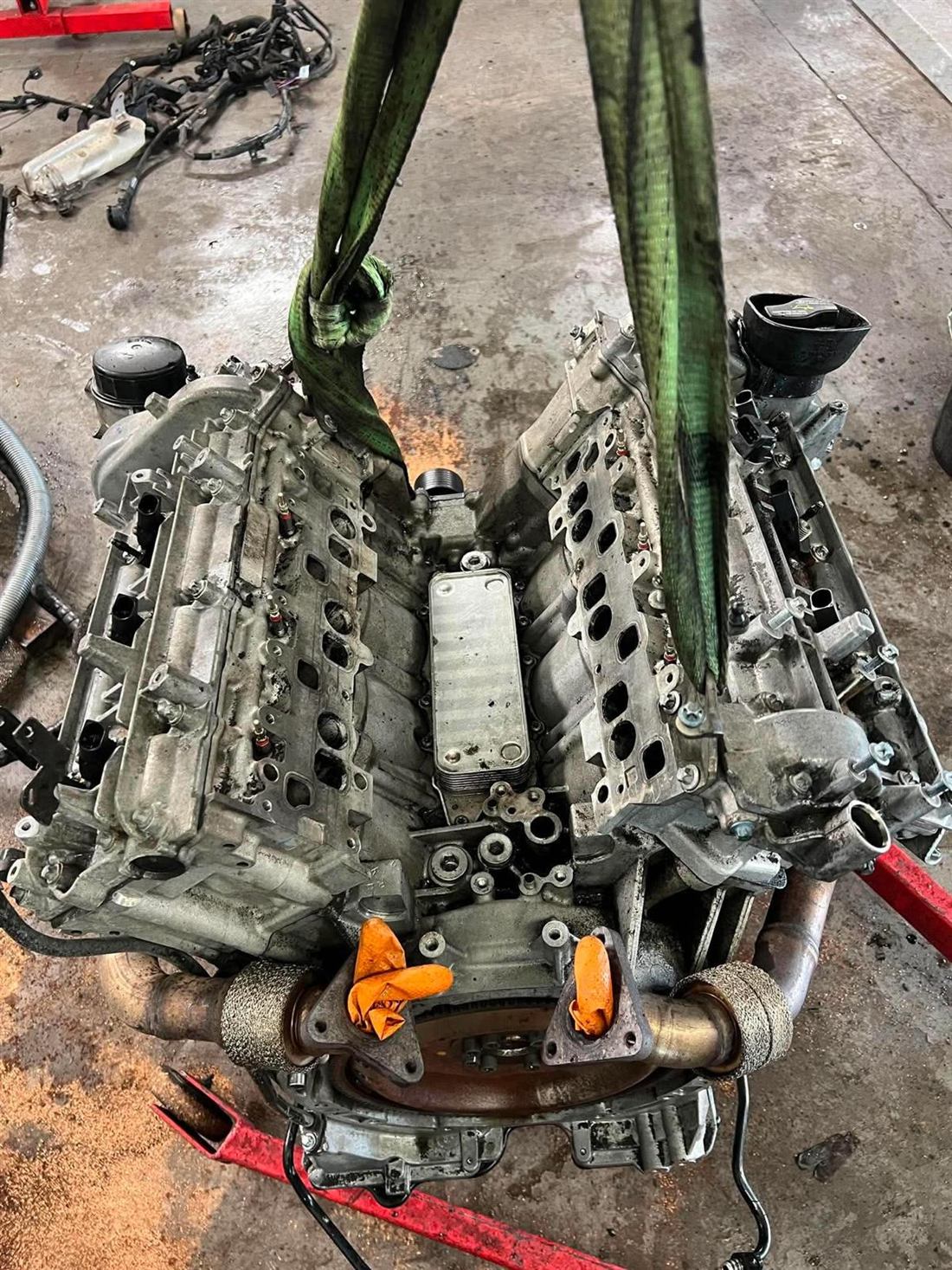 V6 engine on the hoist, stripped